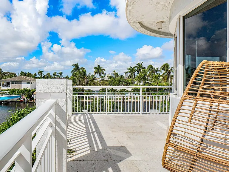 Bask in the Florida sunshine on the private balcony, offering a serene spot for relaxation and scenic views.