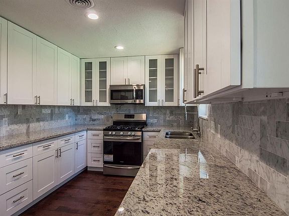 Marble tile backsplash.