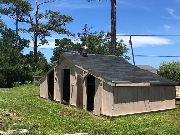 Large three-bay shed in good condition.