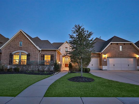 Don't miss this one story beauty in Cinco Ranch Northwest!