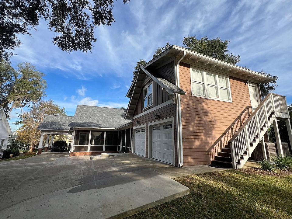 Photo of the Exterior. The carriage house sits atop the garage.