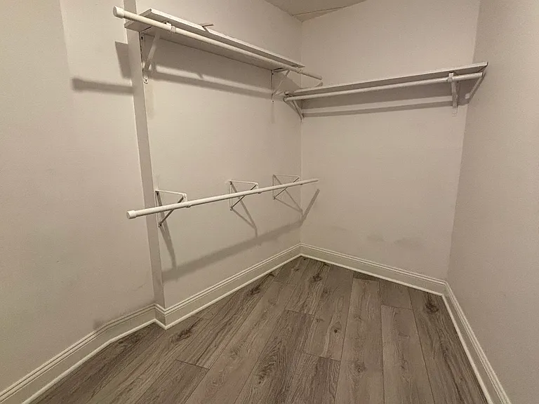 This walk-in closet in the bedroom offers impressive storage space.