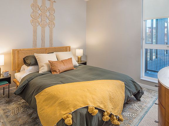 Spacious bedrooms with custom roller shades