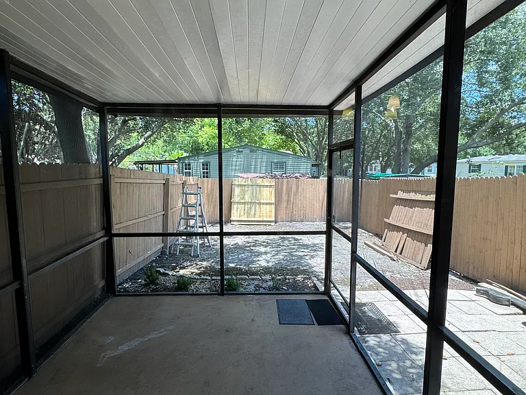 Fenced in Backyard with screened in Porch