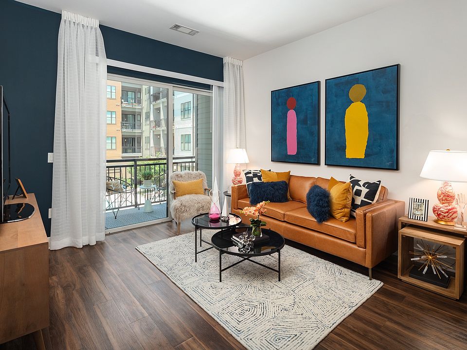 Apartment Living Room Featuring Contemporary Furniture and Large Patio Door