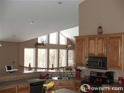 Kitchen with view of windows in living room