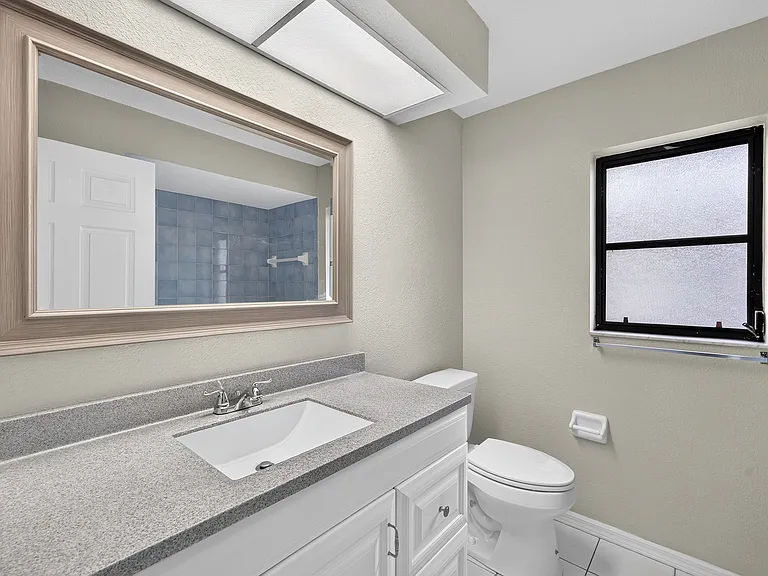 Guest bathroom is situated in the hallway between bedrooms #2 and #3.