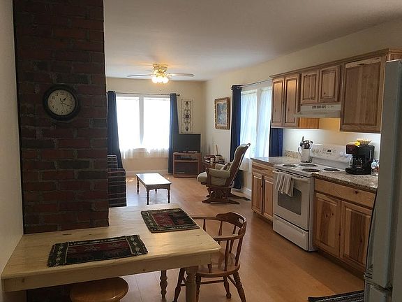 The rear entry from the enclosed porch takes you right into the brand new kitchen and living room - open, clean, and inviting.