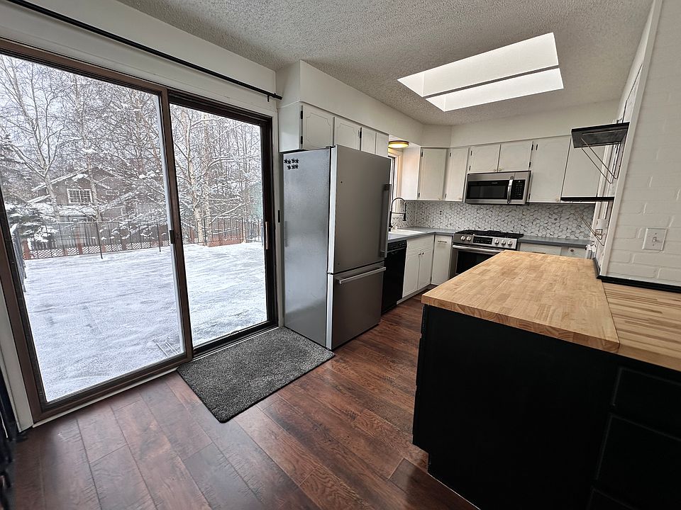 Large deck off of kitchen accessed via sliding door