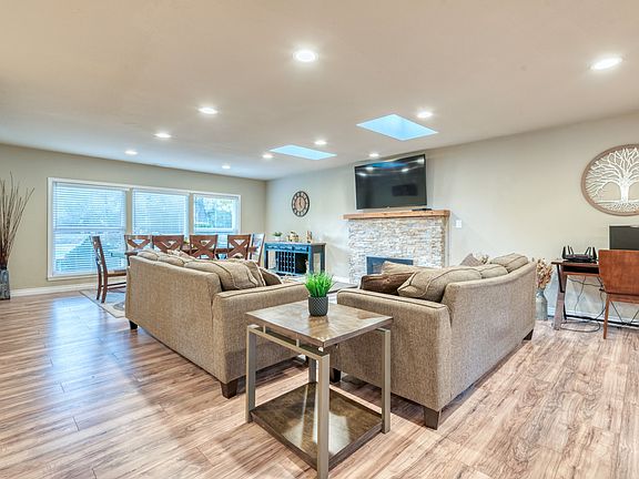 Living room area - designated desk for work and also formal dining area that can easily sit 8. Perfect for family gatherings