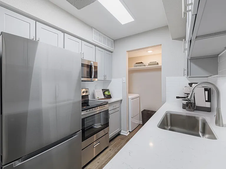 Kitchen with quartz countertops and stainless steel appliances