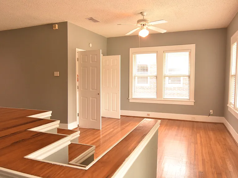 View of den from stair entry