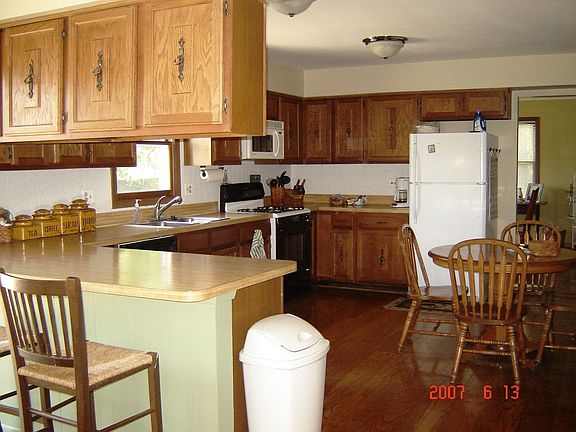 Kitchen with breakfast bar and eat in area