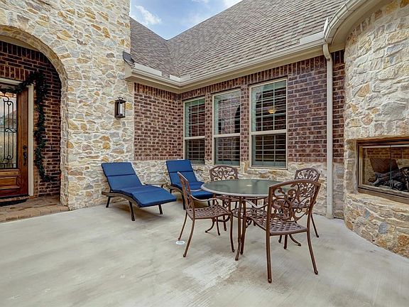 Courtyard with gas log fireplace.