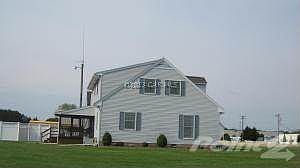 Left side of home with screened porch.