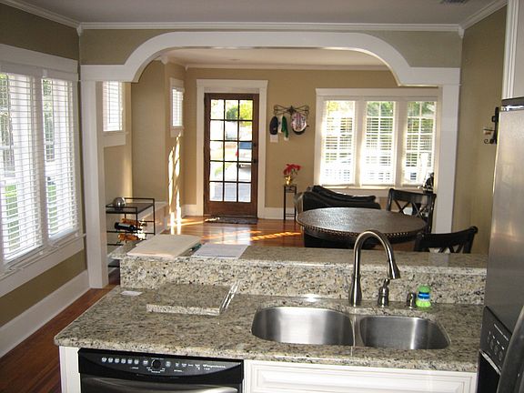 Modern kitchen w/ granite countertops and stainless appliances.