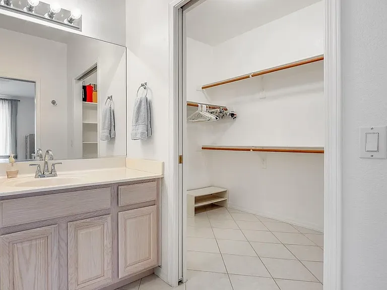 Walk-in closet off the sink.
