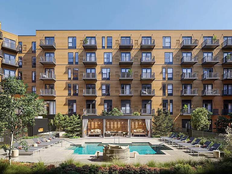 Elegant apartment complex featuring modern balconies and a luxurious pool surrounded by lush greenery and stylish lounge areas.