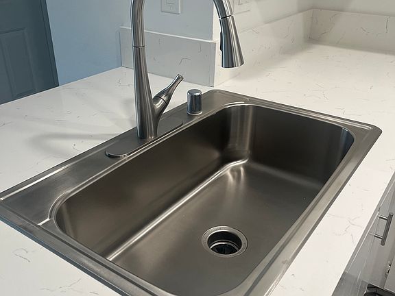 Drop in single sink with extended kitchen faucet