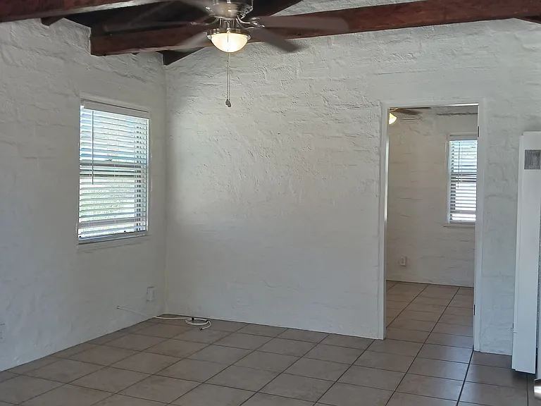LIVING ROOM WITH OPEN BEAMS & CEILING FAN