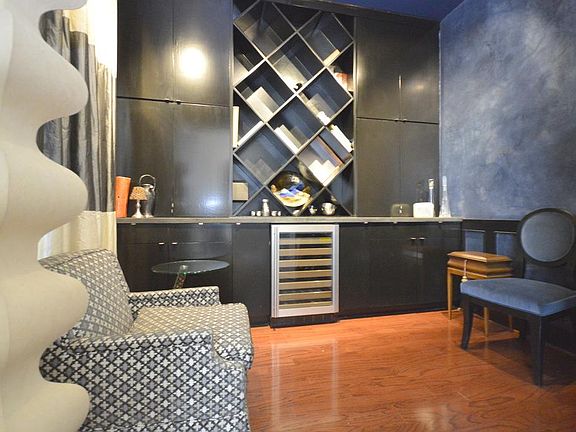 This area can be used as a bar, study, or other living space.