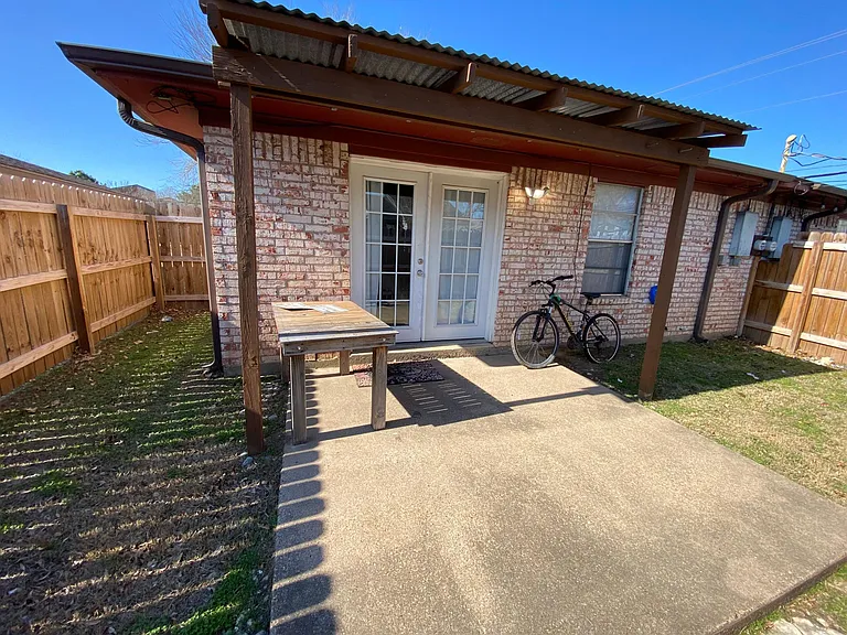 partial view of backyard before fence was painted