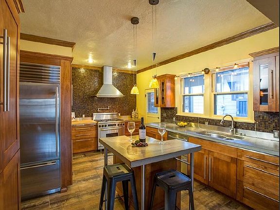 6 Burner Gas oven; Subzero fridge; Concrete counters