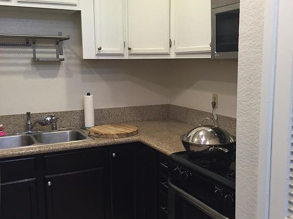 Kitchen with granite counter top and stainless steel applian