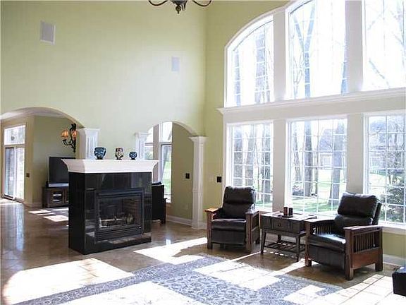 Great Room: 2-Story GR offers plenty of natural sunlight & Dual-sided FP.