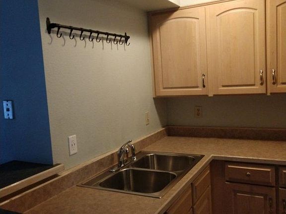 Kitchen Sink area. The shadow on the left causes the wall to appear a different color, but it is not.