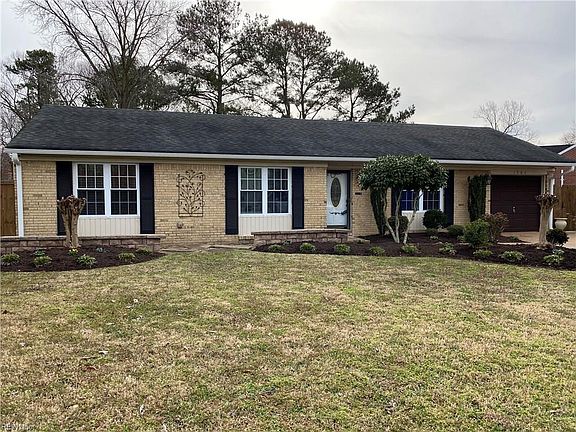 Front view. Excellent curb appeal. Brick front. Extensive landscaping.