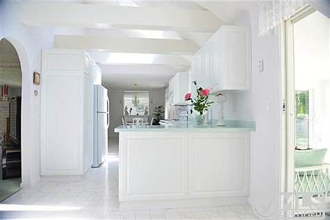 Renovated Kitchen opens to Living Room, Den & Slider to Sunroom