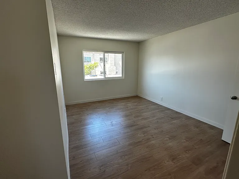 View of Master Bedroom from Private Bathroom Door, sans new window blinds