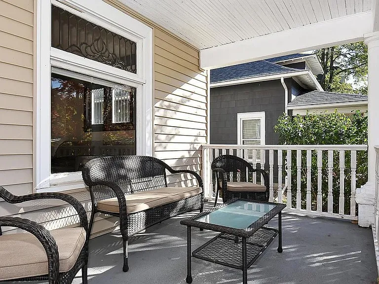 Beautiful covered front porch facing Dupont Avenue.