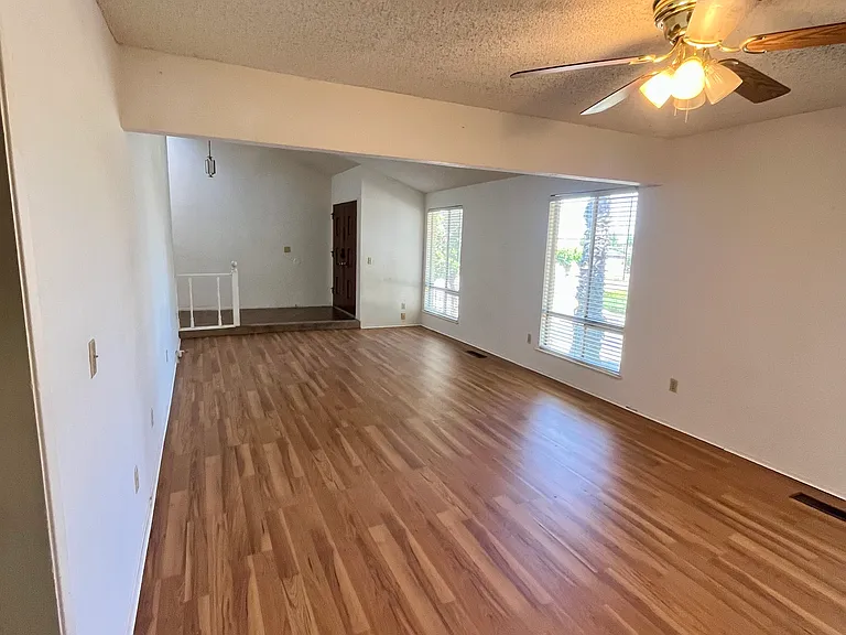 Living and dining rooms, entrance, and hallway.
