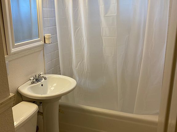 Bathroom with vintage tiles and soaker tub.