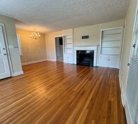 Built in bookshelves and fireplace.