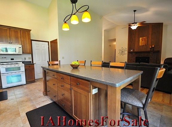 Kitchen-8 foot island with lots of storage including pots and pans drawers. Bar stools included.