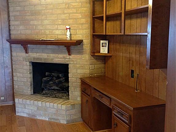 Beautiful fireplace with builtins.