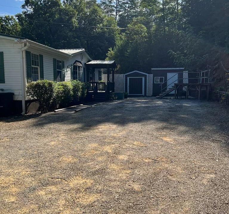 Front driveway, front door, shed 1&2.
