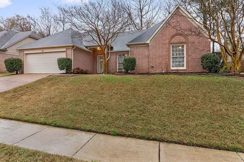 3-Bedroom Brick Home with Fireplace, Primary Suite & Fenced Backyard — Photo 2