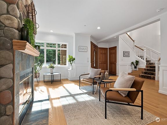 Living room with reading nook. Look at all this light. Fireplace is wood burning but can be converted to propane.>