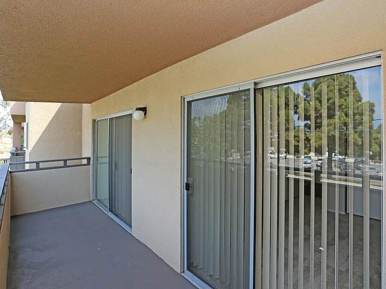 Private balcony with access from master bedroom and livingroom at Villa Pacific Apartments in Oceanside, California.