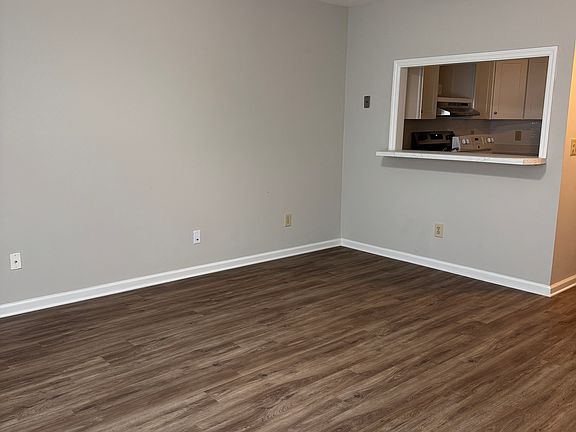 Living room with bar opening to kitchen