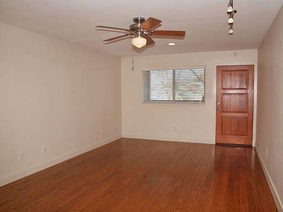 Throughout the main living spaces are attractive wood floors and large windows