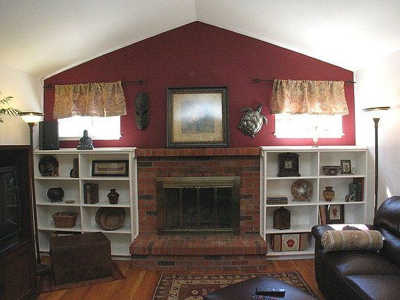 Pottery Barn family room with brick fireplace and hardwood floors