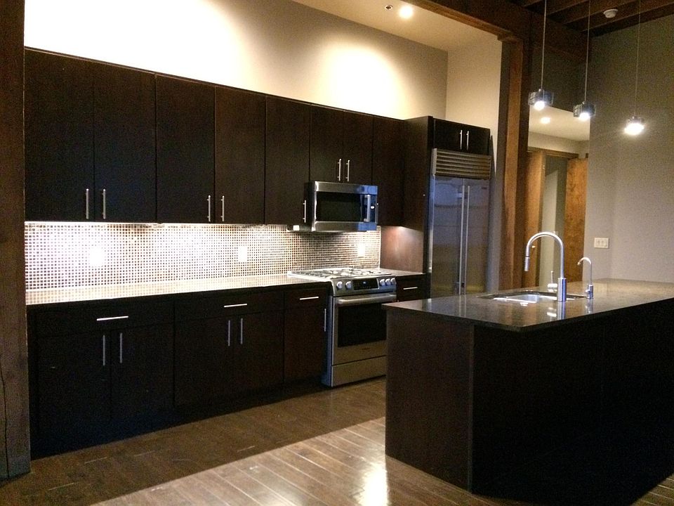 Gorgeous open kitchen, dining & living room area is elegant,