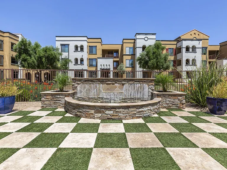 Experience serenity on our green checkered lawn, with a centerpiece fountain