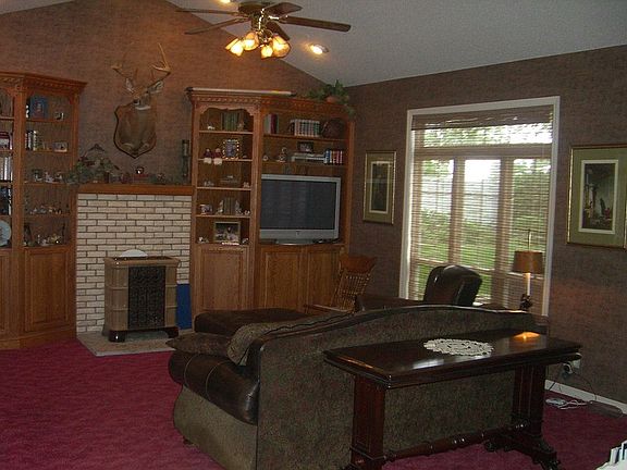 Family Room
						:
						Updated wallpaper and window treatments (2003). Weso ceramic wood-burning stove.