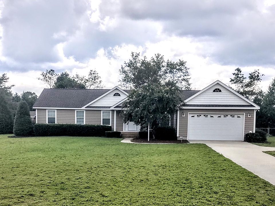 Covered porch, 2 car garage with additonal parking space, concrete drive at end of cul-de-sac